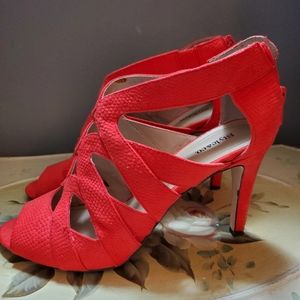 Red pump. Slight orange red. Worn twice